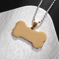 Pendente a forma di osso dorato in acciaio inossidabile con catena a sfere argento - Oro