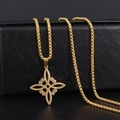 Macro shot of gold Celtic knot pendant on textured black leather jewelry box - Gold Witch Knot Necklace