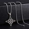 Macro shot of silver stainless steel witch knot pendant with intricate celtic engraving - Silver Witch Knot Necklace