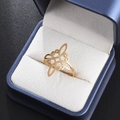 Macro detail of golden Celtic knot stainless steel ring inside a premium jewelry gift box - Gold