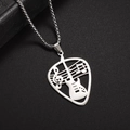 Macro shot of silver guitar pick necklace with hollowed-out musical note and treble clef details - Silver