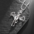 Detailed close-up of a silver devil girl pendant with wings on a classic box chain - Vintage Silver (Bat Girl Necklace)