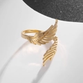 Detail of adjustable golden wings ring showing delicate feather texture and metal finish - Double Wing (Gold)