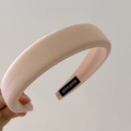 Detail of light pink padded sponge headband with handmade label and twill fabric texture - Khaki