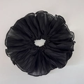 Macro detail of large black pleated fabric scrunchie with elegant ruched texture - Black
