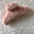 Detailed view of large plush hair claw clip in soft pink faux fur for thick hair styling - Pink