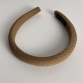 Detailed view of the handmade label on khaki twill fabric sponge headband - Khaki
