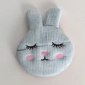Macro detail of cute light blue corduroy bunny hair clip with soft embroidered face details - Blue Rabbit