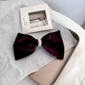 Elegant wine red velvet bow hair clip with pearl beads on a golden decorative tray - Pearl Burgundy