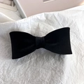 Detail of elegant black silk velvet bow hair clip showing soft texture and symmetrical design - Mini Bowknot Necklace