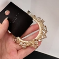 Dettaglio dell'elastico per capelli in cristallo champagne con perline ambrate sfaccettate - Champagne