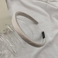 Detail of handmade cream white satin headband with smooth pearlescent fabric finish - Off White
