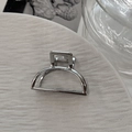 Detail of silver alloy mini hair claw clip with a polished finish and metal spring - Semicircle Silver