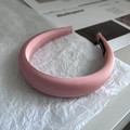 Detail of pink satin sponge headband with handmade woven label on inner side - Grapefruit Red
