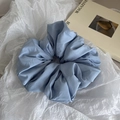 Close-up of oversized dusty blue scrunchie with matte twill fabric on white textured paper - Light Blue