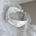 Elegant off-white wide headband with floral jacquard texture and twisted knot design - White