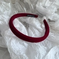 Close-up of burgundy velvet padded headband with a handmade label on the inner side - Burgundy