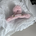 Detail of pink faux fur hair claw clip featuring inlaid pearls and sparkling rhinestones - Pink