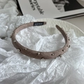 Close-up of a handmade brown fabric headband with silver beads and rhinestones detail - Khaki Headband