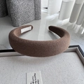 Detail of a thick padded knitted headband in dark brown fabric with a soft texture - Light Coffee