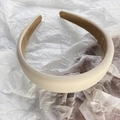 Detailed view of thick cream sponge headband featuring a soft light brown velvet inner lining - Apricot