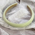 Detailed close-up of light green PU leather headband with anti-slip brown suede lining - Light Green