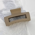 Macro detail of the matte khaki rectangle hollow hair claw clip with strong teeth - Khaki