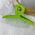 Detail of neon green matte claw clip showing internal comb teeth for thick hair - Green