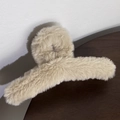 Detail of soft cream plush hair claw clip with a focus on fluffy faux fur texture - Khaki