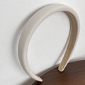 Detail view of thickened off-white sponge headband with smooth silk texture fabric - Milk White