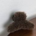 Close-up of deep brown plush claw clip with faux lamb wool texture for winter - Dark Coffee