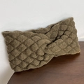 Detail showing thick olive green knitted headband with twist knot and texture - Light Coffee