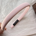 Detail of pink padded sponge headband with handmade label and matte fabric texture - Light Pink