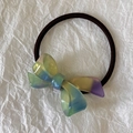 Close-up of gradient acetate bow hair tie on a white paper background - Blue Green Gradient