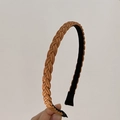 Detail of hand-woven brown braid texture and non-slip lining on the slim headband - Brown
