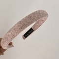 Detailed macro view of the hand-made woven texture on this pink vintage sponge headband - Pink