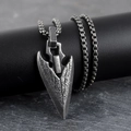 Vintage Viking spearhead pendant necklace with rustic texture on dark stone base - Silver