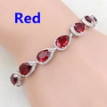 Detail of silver tennis bracelet with seven red pear-cut stones and adjustable clasp - Red
