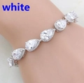 Close-up of a silver-tone bracelet featuring pear-cut white stones in a cluster design - White