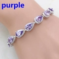 Close-up of a pear-cut purple gemstone bracelet with white zircon pave on the wrist - Purple