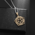 Macro shot of gold pentagram tree of life pendant on a luxury black leather texture gift box - Gold