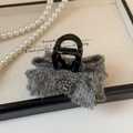 Dettaglio di fermaglio per capelli in tweed grigio con fili dorati e cristallo lucido - Grigio Blu Artiglio per Capelli