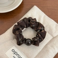 Retro floral scrunchie in dark brown fabric with elegant bead detail for hair - Brown