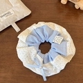 Detailed close-up of blue plaid scrunchie with white lace edges and pearl bow accent - Blue Plaid Scrunchie