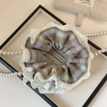 Close-up of vintage plaid scrunchie with white lace trim on an elegant display tray - Coffee Solid Lace Scrunchie