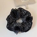 Detailed view of black floral scrunchie with multi-layer mesh trim and ruffle texture - Black Mesh Floral