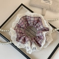 Detail view of pink plaid scrunchie with 3cm white lace trim in a romantic setting - Pink Lace Scrunchie