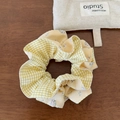 Detailed view of yellow floral and plaid fabric textures on this stylish scrunchie - Hair Tie / Yellow Checkered Double Layer