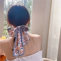 Elegant grey-purple floral ribbon hair scarf tied into a bow on a ponytail hairstyle - Sunflower