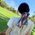 French vintage ribbon hair tie with colorful geometric diamond pattern and blue border - Red and Blue Argyle